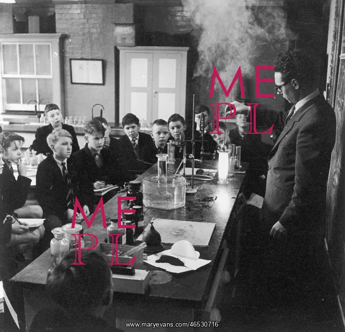 : Teacher gives demonstration to schoolboys in a science class : Teacher gives demonstration to schoolboys in a science class