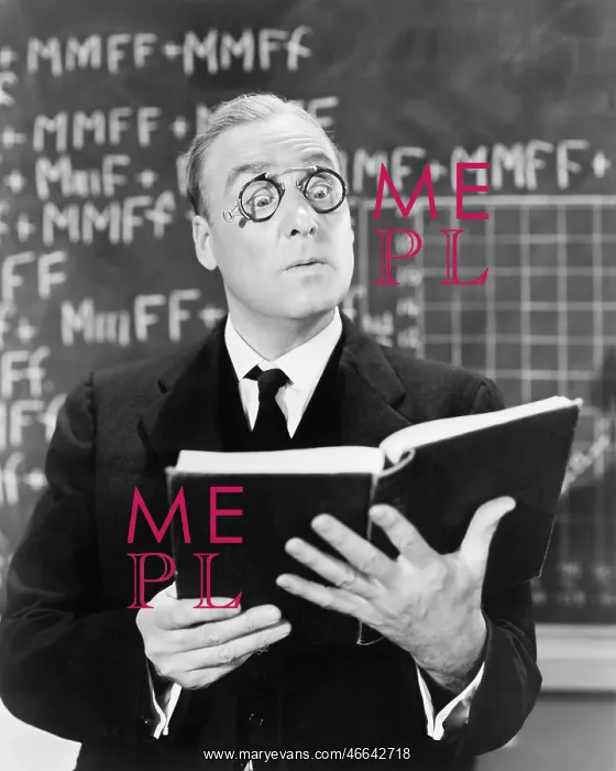 : Teacher holding a book in front of a black board : Teacher holding a book in front of a black board