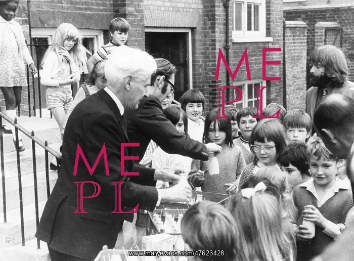 : Teachers distributing milk to children, Woolwich, London : Teachers distributing milk to children, Woolwich, London