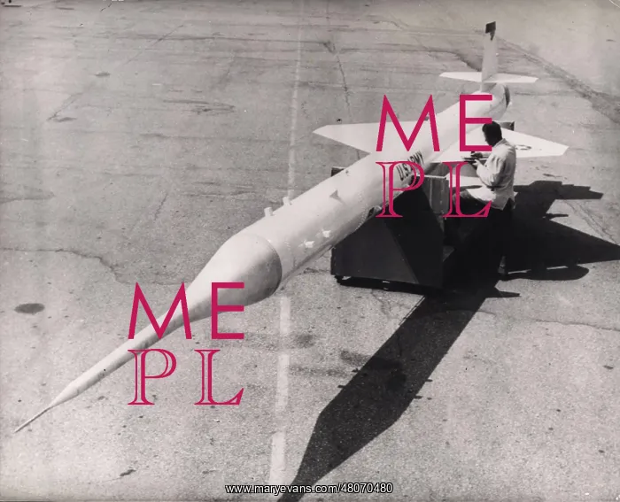 : Technician checking Lockheed X-7 guided missile : Technician checking Lockheed X-7 guided missile