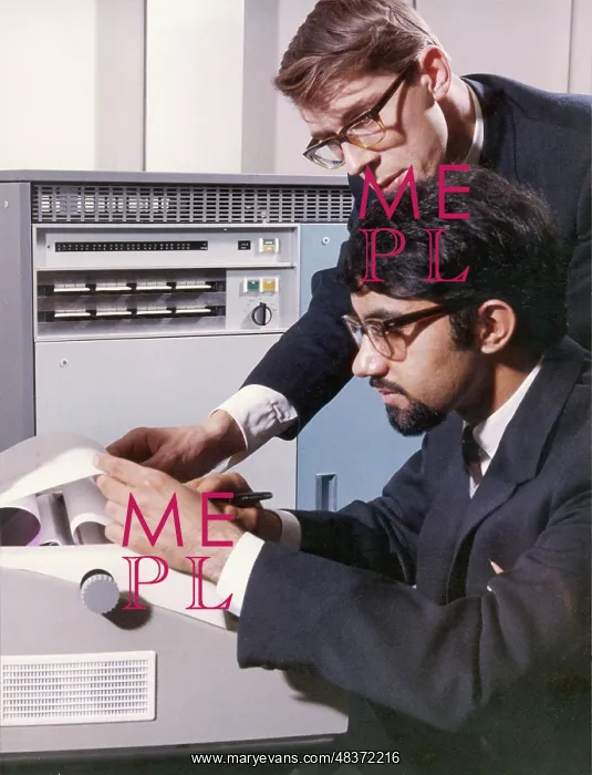 : Two technicians check a computer printout : Two technicians check a computer printout