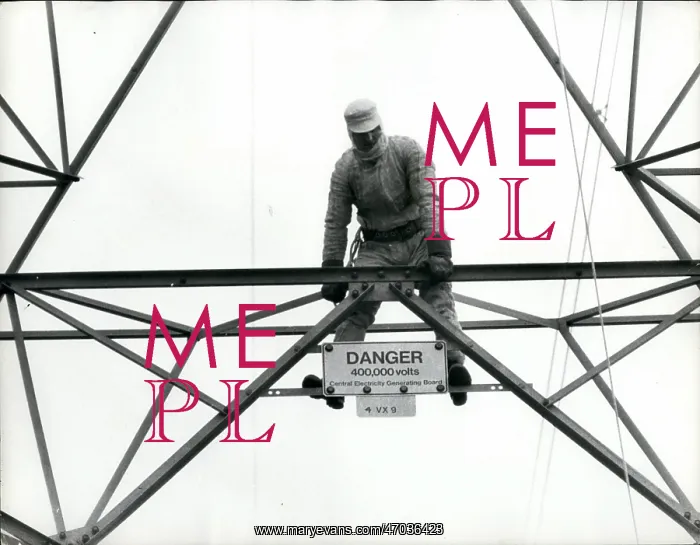 : Ted Malpass on electricity pylon in protective suit : Ted Malpass on electricity pylon in protective suit