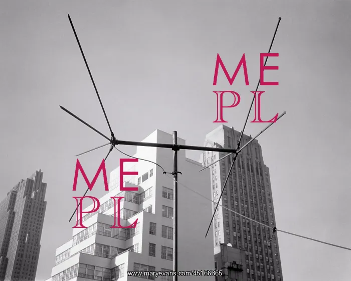 : Television Antenna Beside Tall Skyscraper : Television Antenna Beside Tall Skyscraper