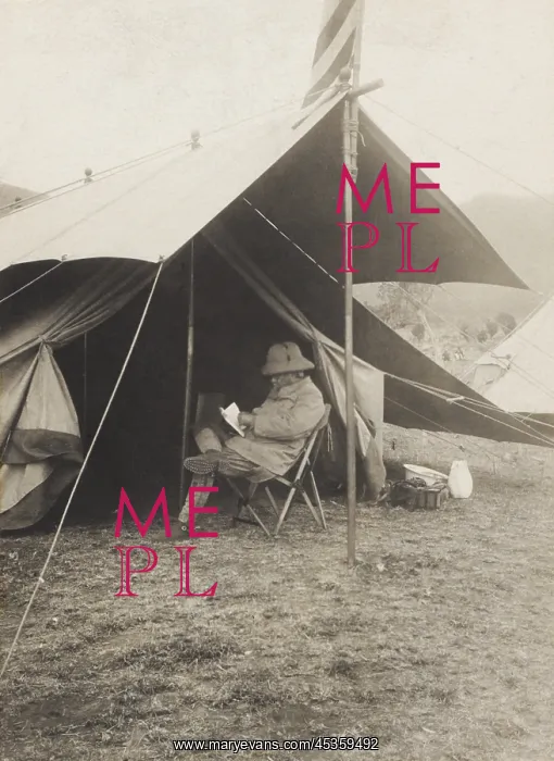 : Theodore Roosevelt reading in front of his tent : Theodore Roosevelt reading in front of his tent