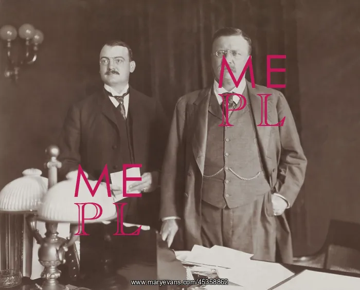 : Theodore Roosevelt standing behind desk, with Asst : Theodore Roosevelt standing behind desk, with Asst