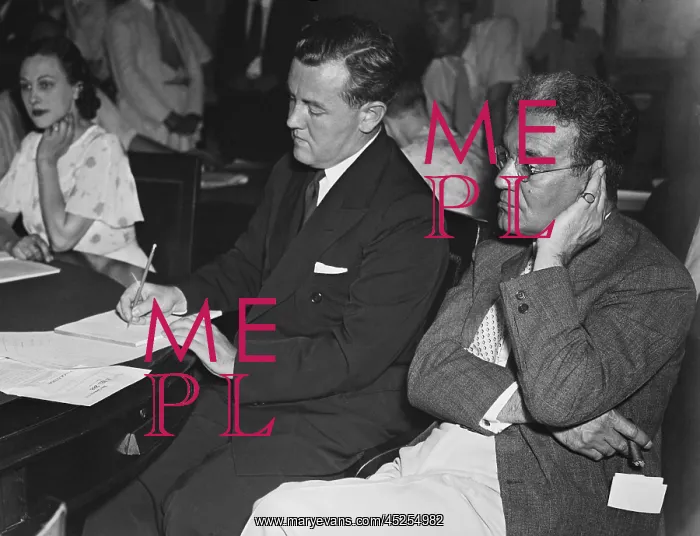 : Thomas Corcoran (center) is grilled at a House : Thomas Corcoran (center) is grilled at a House