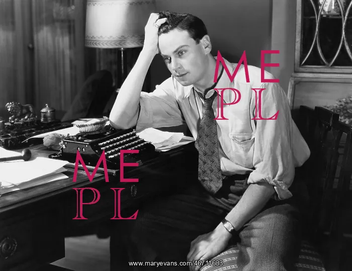 : Thoughtful man at a typewriter : Thoughtful man at a typewriter