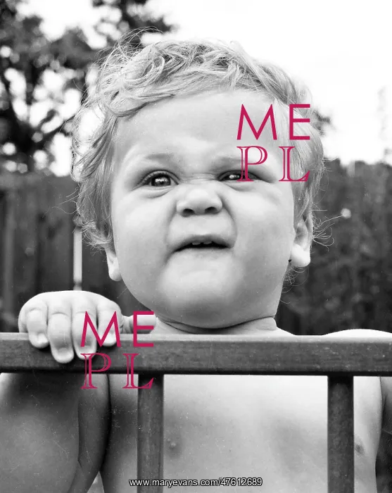  : Toddler in a playpen in a garden