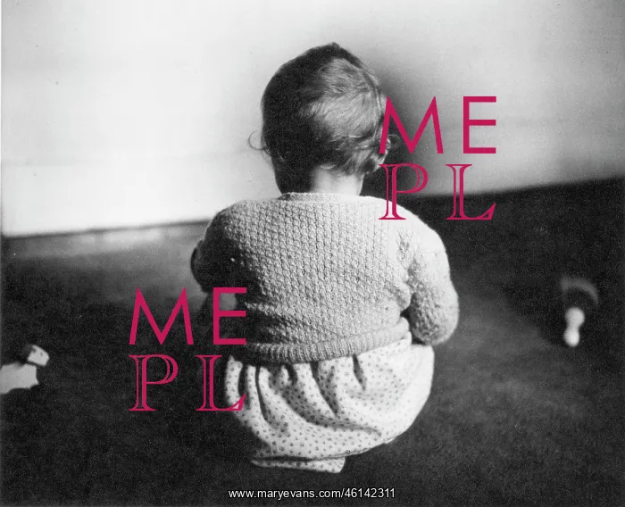 : Toddler sitting on a carpet : Toddler sitting on a carpet