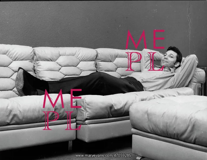 : Tom Jones, singer, relaxing on his sofa at home : Tom Jones, singer, relaxing on his sofa at home