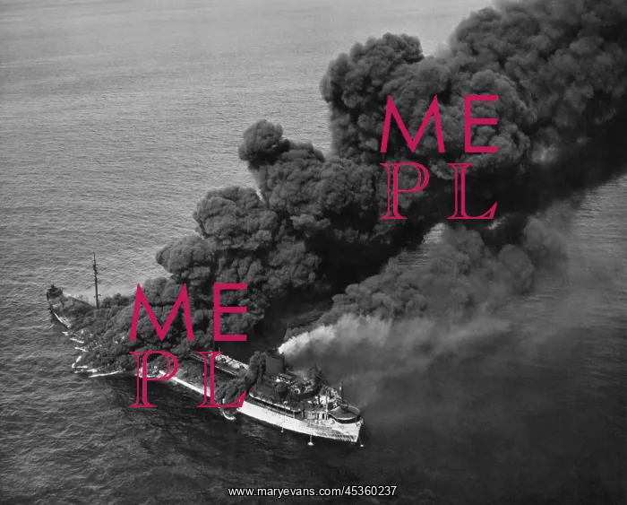 : A torpedoed American tanker burning after an Axis : A torpedoed American tanker burning after an Axis