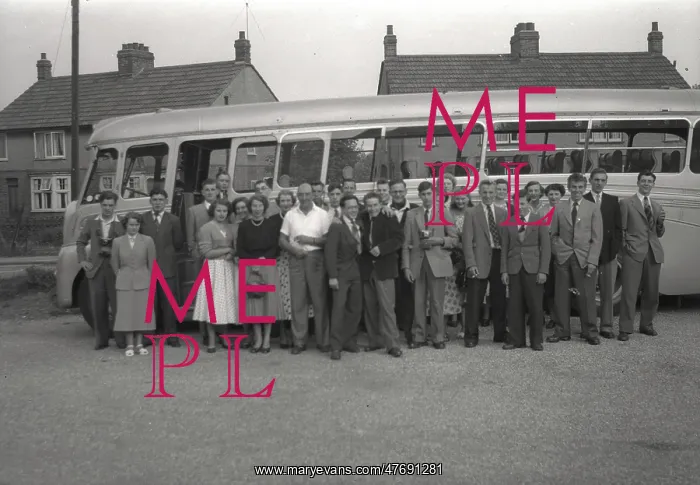 : A Tour party pose next to their Coach : A Tour party pose next to their Coach