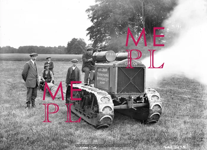 : Tractor - a view of men in a field beside a motorised Clayton tractor with a lot of smoke : Tractor - a view of men in a field beside a motorised Clayton tractor with a lot of smoke