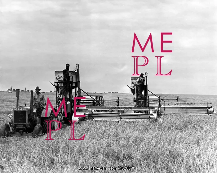 : A tractor used to pull two combines on a ? : A tractor used to pull two combines on a ?