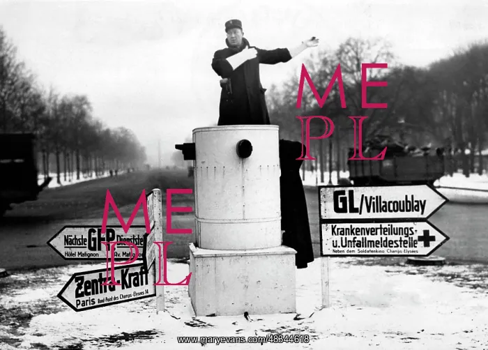 : Traffic policeman at a roundabout in Paris, 1942 : Traffic policeman at a roundabout in Paris, 1942