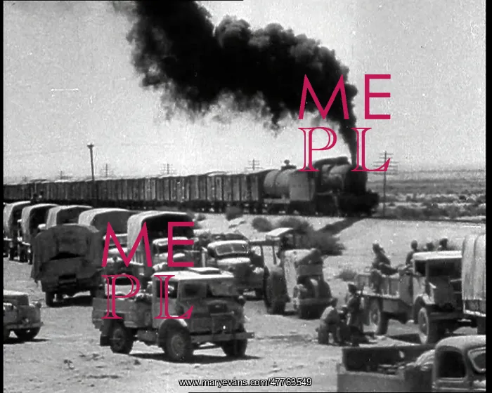 : A Train Riding Past a British Motorised Column : A Train Riding Past a British Motorised Column