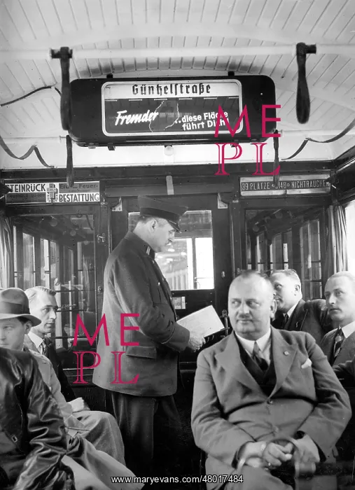 : Tram conductor in a Berlin tram, 1934 : Tram conductor in a Berlin tram, 1934
