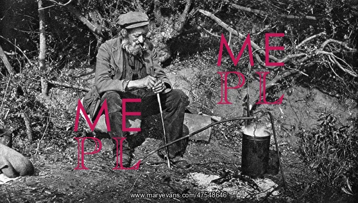 : A tramp sitting next to a fire : A tramp sitting next to a fire