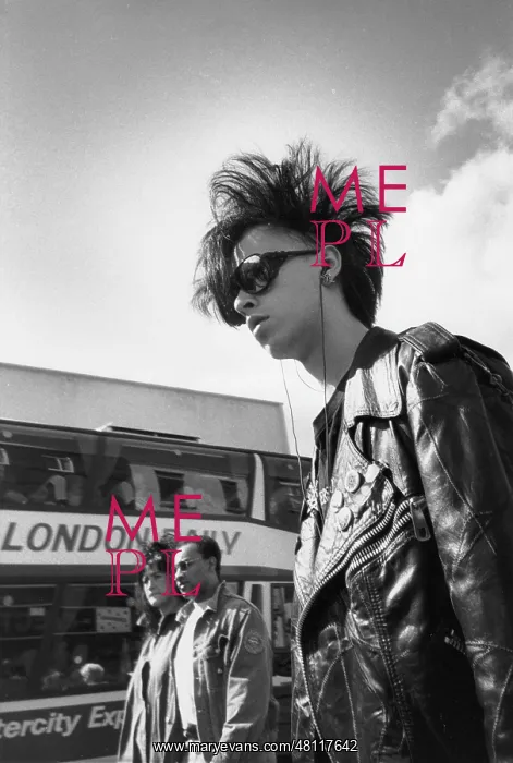 : Trendy young man in a leather jacket and sunglasses : Trendy young man in a leather jacket and sunglasses