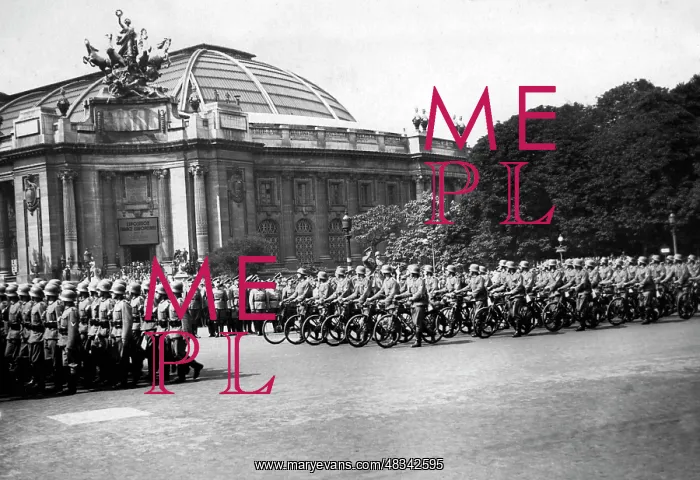 : Troops parade along the Champs-Elysee in Paris, 1940 : Troops parade along the Champs-Elysee in Paris, 1940