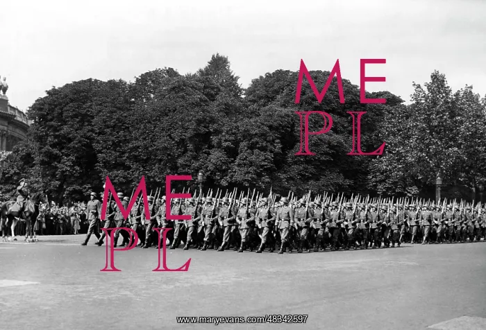 : Troops parade along the Champs-Elysee in Paris, 1940 : Troops parade along the Champs-Elysee in Paris, 1940