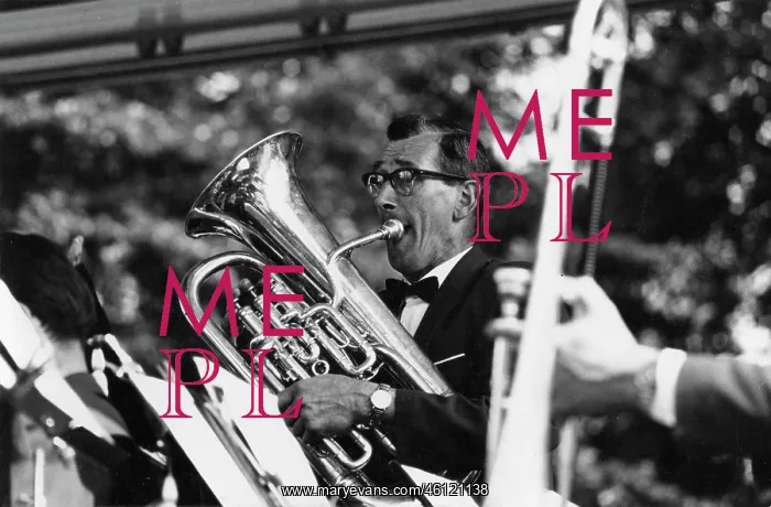 : Tuba player in band on a bandstand : Tuba player in band on a bandstand