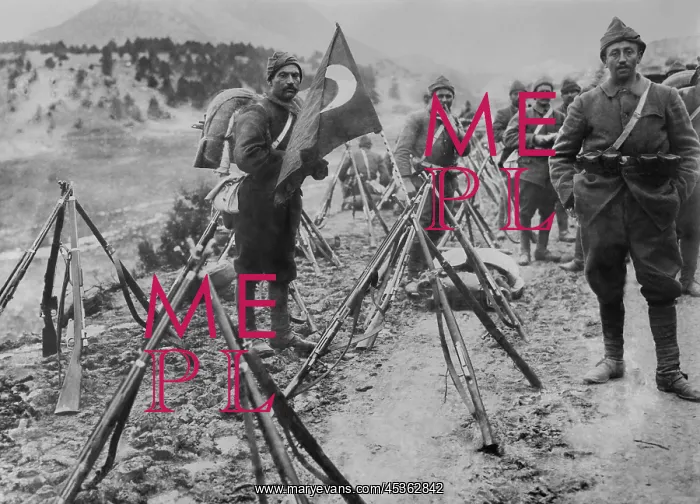 : Turkish infantry column at rest with flag and rifles : Turkish infantry column at rest with flag and rifles