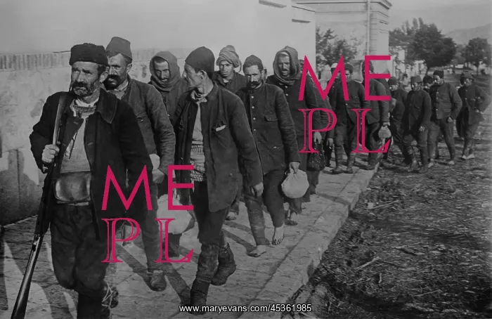  : Turkish prisoners, led by an armed guard, enter