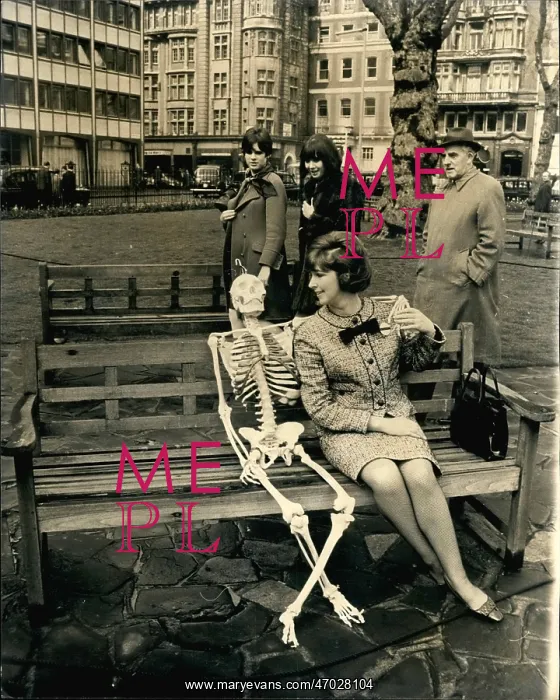 : TV presenter with skeleton on bench, Hanover Square, London : TV presenter with skeleton on bench, Hanover Square, London
