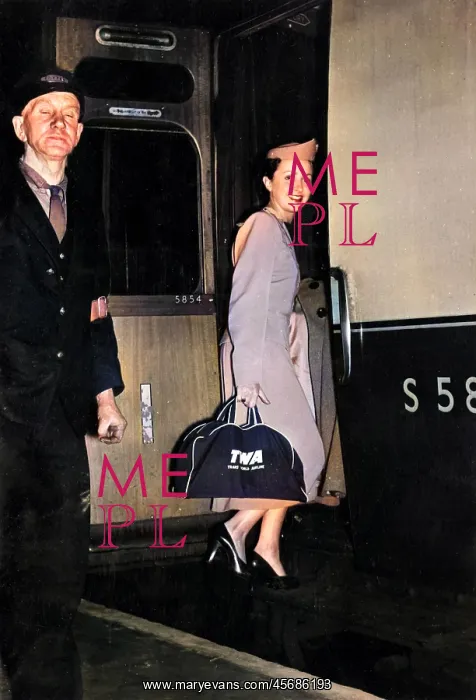 : TWA air stewardess boarding a train : TWA air stewardess boarding a train