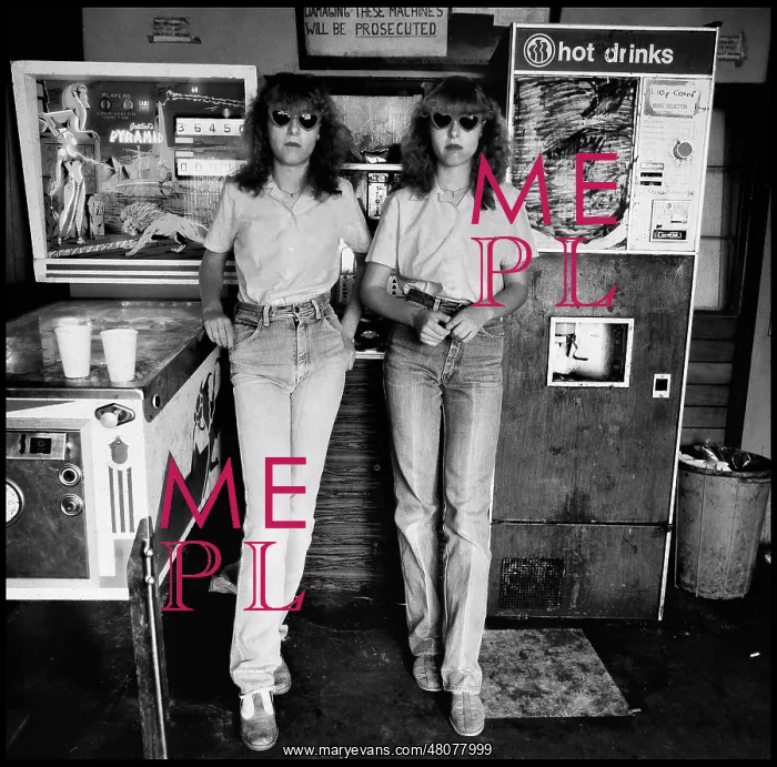  : Twin girls in arcade with pintable