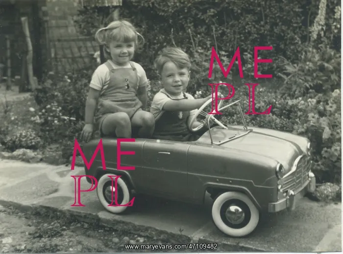 : Twins in a toy car : Twins in a toy car