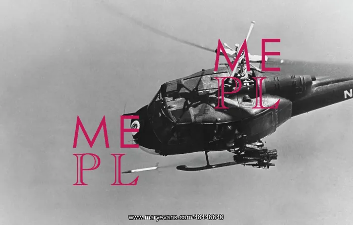 : A UH-1 helicopter gunship fires a 2.75-inch : A UH-1 helicopter gunship fires a 2.75-inch