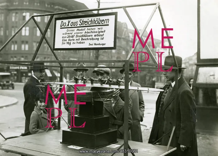 : Unemployed people display an airplane model : Unemployed people display an airplane model