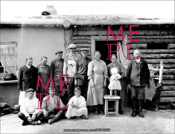 : Unidentified group outside a hut : Unidentified group outside a hut