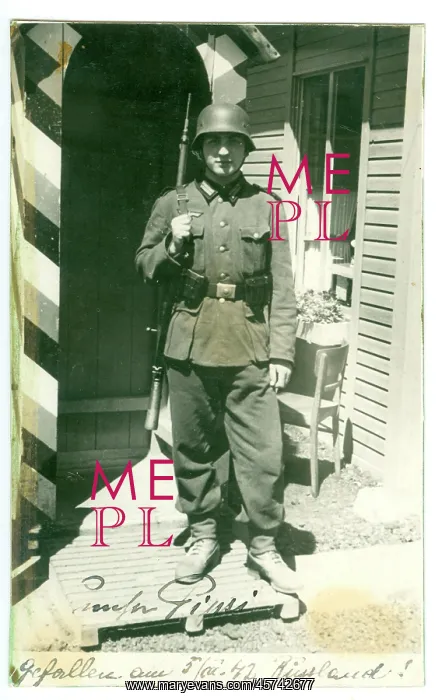 : A uniformed helmeted German soldier on sentry duty : A uniformed helmeted German soldier on sentry duty