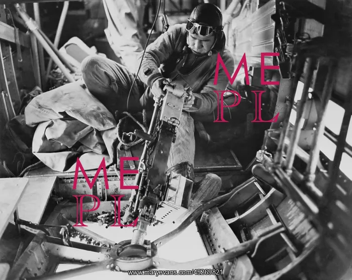 : U.S. Army Air Force gunner operating a machine : U.S. Army Air Force gunner operating a machine