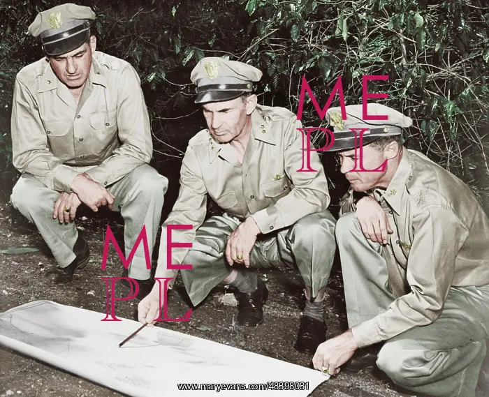 : U.S. Army members reviewing a map in the South : U.S. Army members reviewing a map in the South