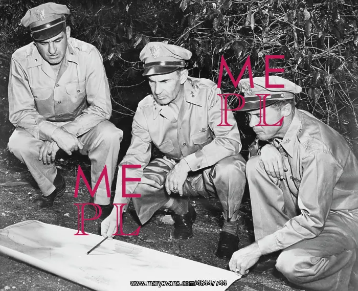 : U.S. Army members reviewing a map in the South : U.S. Army members reviewing a map in the South