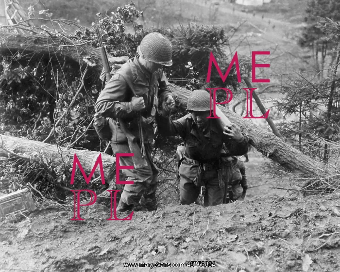 : U.S. Infantrymen, in the Hurtgen Forest. One soldier : U.S. Infantrymen, in the Hurtgen Forest. One soldier