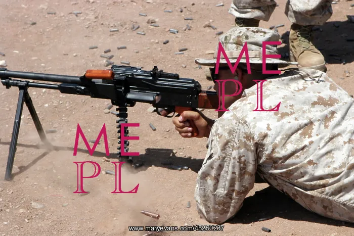 : U.S. Marine Corps Sgt. fires a PKM machine gun : U.S. Marine Corps Sgt. fires a PKM machine gun