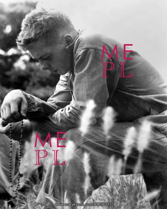 : U.S. Marine in prayer for the safety of himself : U.S. Marine in prayer for the safety of himself