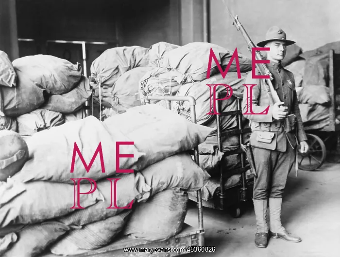 : U.S. Marine standing guard over sacks of mail, Washington : U.S. Marine standing guard over sacks of mail, Washington