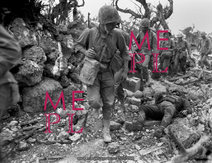 : U.S. Marines pass through a small village where : U.S. Marines pass through a small village where