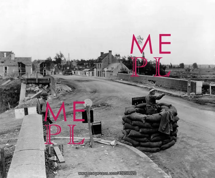 : U.S. MP controls traffic on a bridge at Carentan : U.S. MP controls traffic on a bridge at Carentan