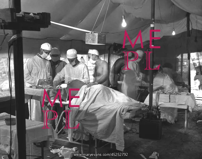 : U.S. Navy doctors and corpsmen operate on two : U.S. Navy doctors and corpsmen operate on two