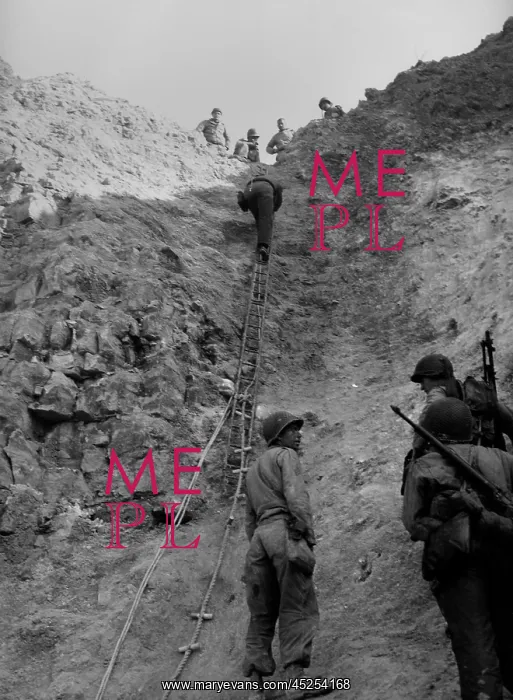 : U.S. Rangers climb a cliff using a rope ladders : U.S. Rangers climb a cliff using a rope ladders