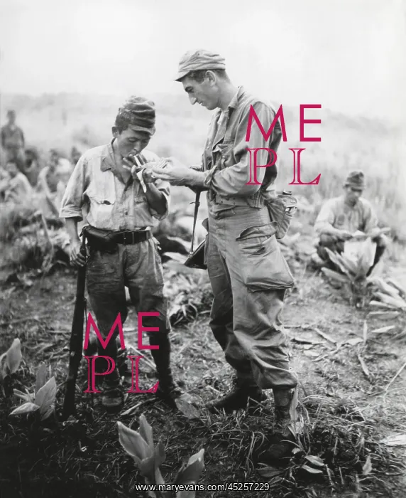  : U.S. soldier of lights a cigarette for a former