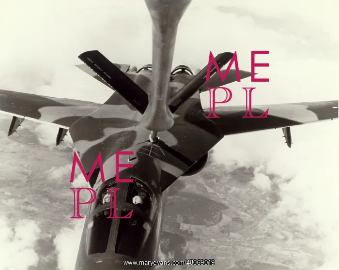 : A USAF General Dynamics F-111E refuels : A USAF General Dynamics F-111E refuels