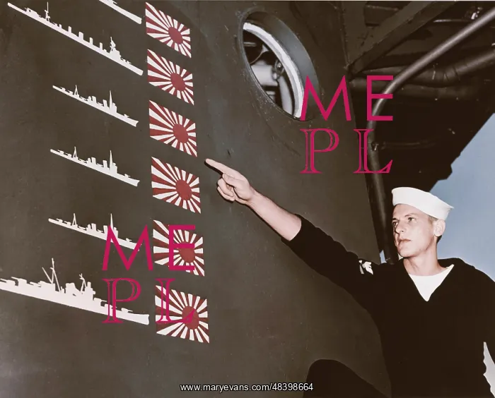 : USS Boise sailor points out details of the : USS Boise sailor points out details of the